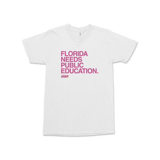 White crewneck t-shirt with bold pink text saying "FLORIDA NEEDS PUBLIC EDUCATION. ANGIN" on the front.