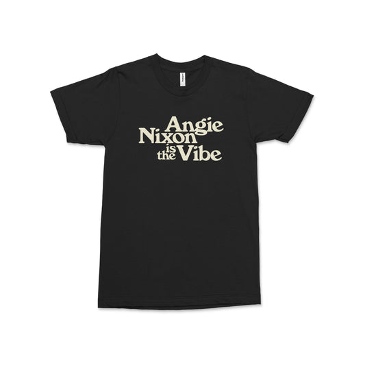 Black crew neck t-shirt with "Angie Nixon Is the Vibe" text in cream font on front.
