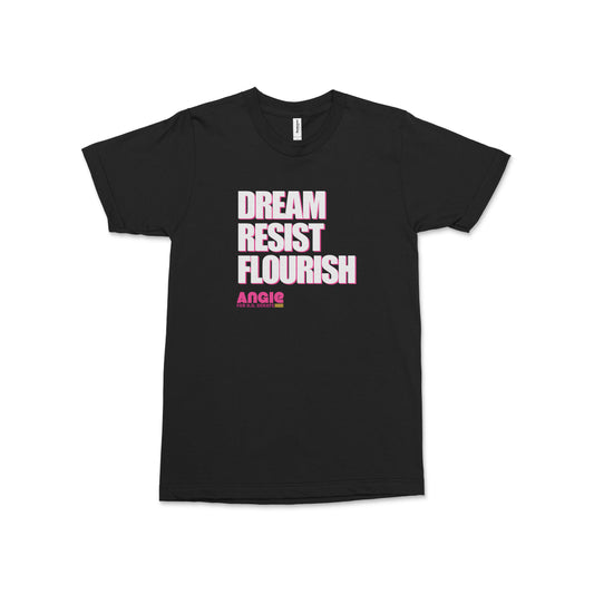 Black short-sleeve t-shirt with bold white and pink "Dream Resist Flourish" text on front.