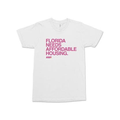 White crew neck t-shirt with bold pink text reading Florida Needs Affordable Housing Angie Nixon for U.S. Senate on front.