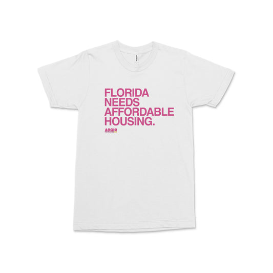 White crew neck t-shirt with bold pink text reading Florida Needs Affordable Housing Angie Nixon for U.S. Senate on front.